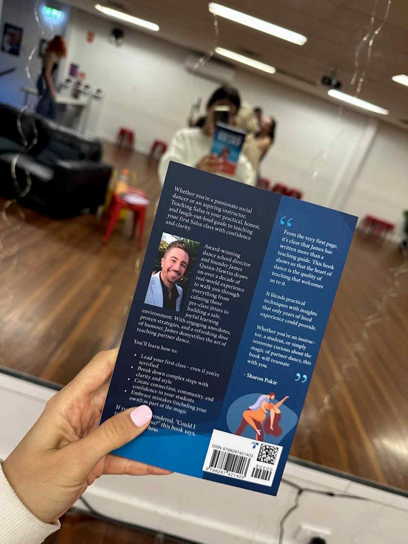 The back cover of Teaching Salsa, held up in the Dance Culture studio
